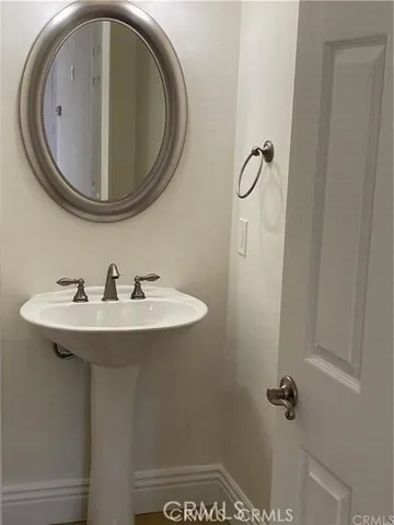 a bathroom with a sink and mirror