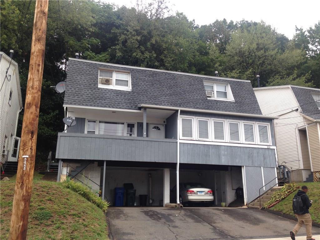 333 Mill Rock Road, Unit 333 Hamden, CT 06517 - Photo 1 of 1 a front view of a house with a yard and garage
