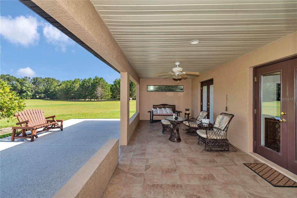 1671 West Highway 316 Citra, FL 32113 - Photo 24 of 46 a view of swimming pool with outdoor seating and yard
