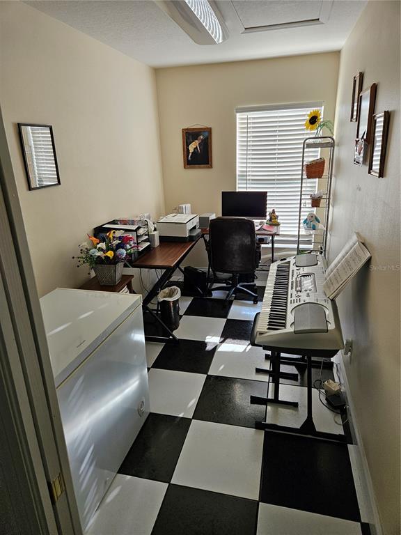 1671 West Highway 316 Citra, FL 32113 - Photo 27 of 46 a view of a workspace with furniture and a couch