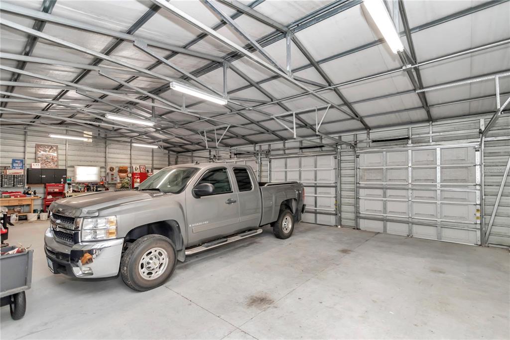 1671 West Highway 316 Citra, FL 32113 - Photo 31 of 46 a view of parking garage with cars