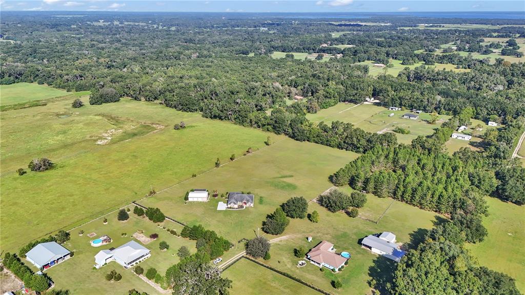 1671 West Highway 316 Citra, FL 32113 - Photo 43 of 46 an aerial view of a residential houses with outdoor space