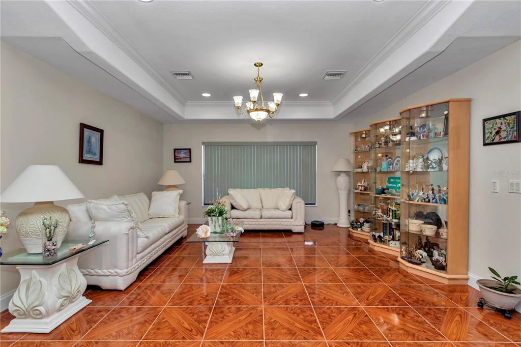 1671 West Highway 316 Citra, FL 32113 - Photo 6 of 46 a living room with furniture and a chandelier