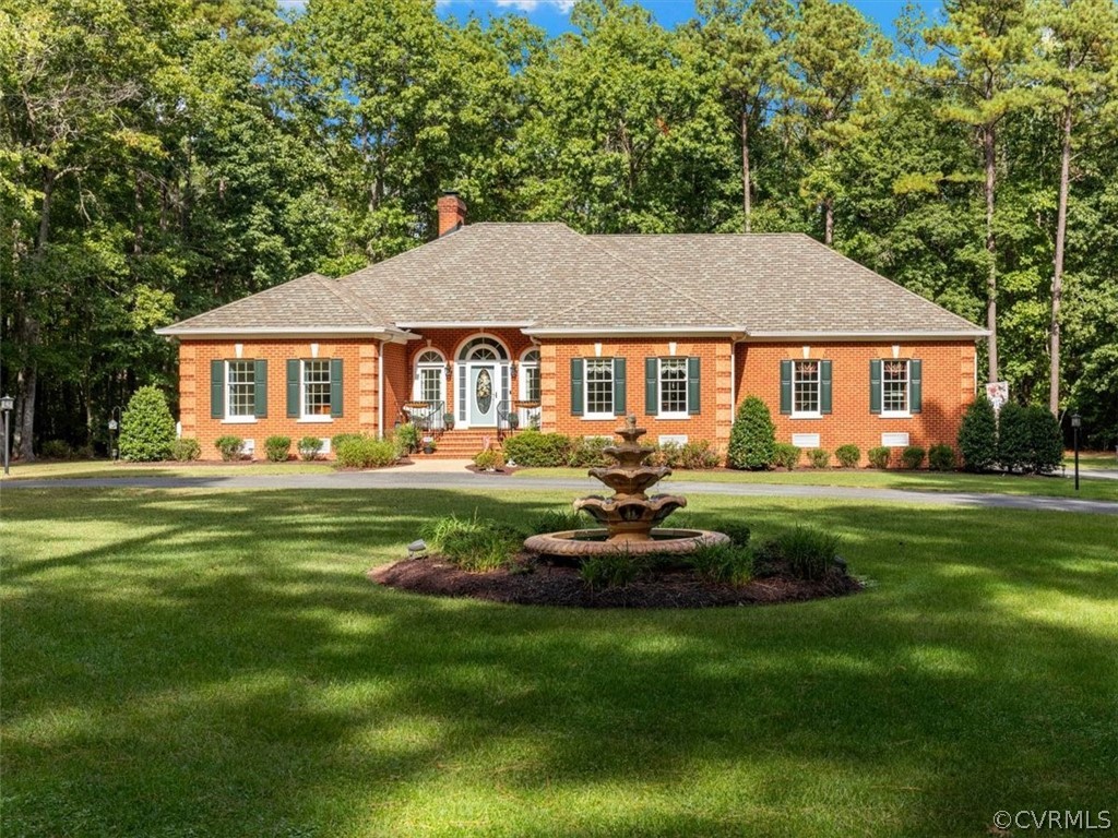 a front view of a house with a yard table and chairs