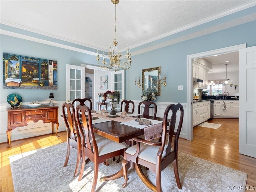 13030 River Road Chesterfield, VA 23838 - Photo 13 of 50 a view of a dining room with furniture and wooden floor