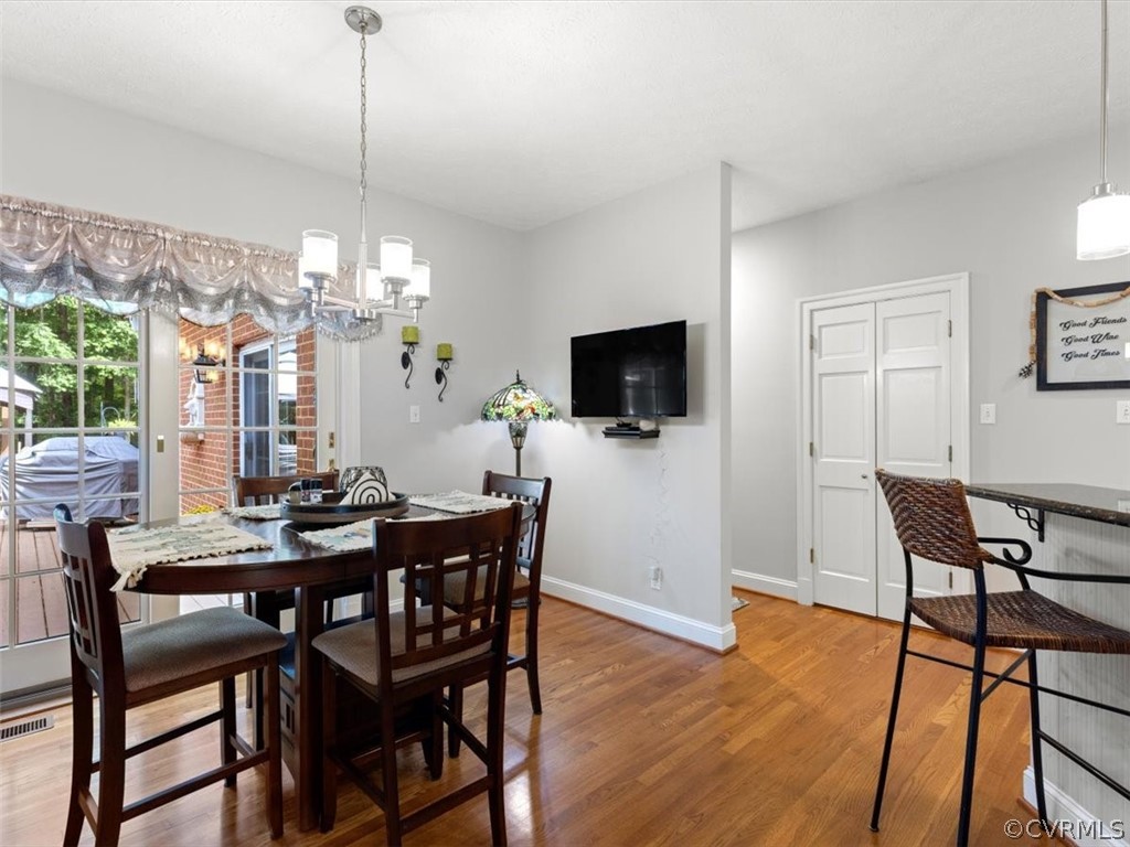 13030 River Road Chesterfield, VA 23838 - Photo 18 of 50 a view of a dining room with furniture window and wooden floor