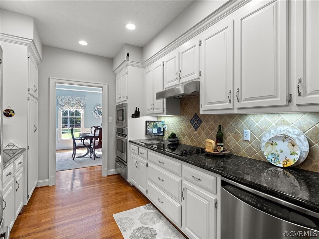 13030 River Road Chesterfield, VA 23838 - Photo 20 of 50 a kitchen with sink cabinets and wooden floor