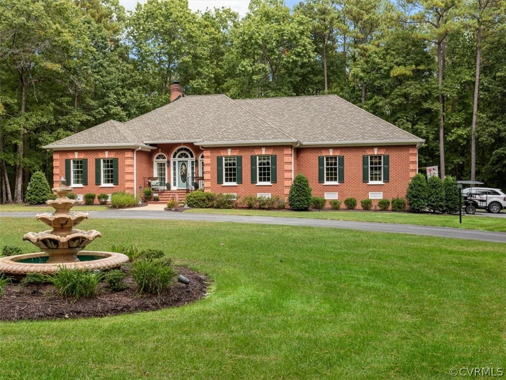 13030 River Road Chesterfield, VA 23838 - Photo 2 of 50 a front view of a house with a yard and trees