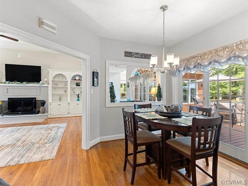 13030 River Road Chesterfield, VA 23838 - Photo 22 of 50 a view of a dining room with furniture window and wooden floor