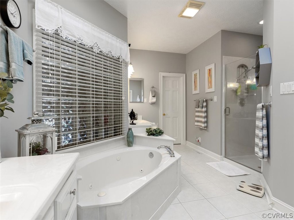 13030 River Road Chesterfield, VA 23838 - Photo 29 of 50 a bathroom with a bathtub and a sink