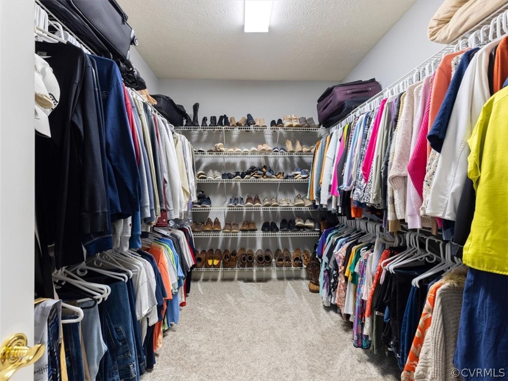 13030 River Road Chesterfield, VA 23838 - Photo 30 of 50 a view of walk in closet with clothes