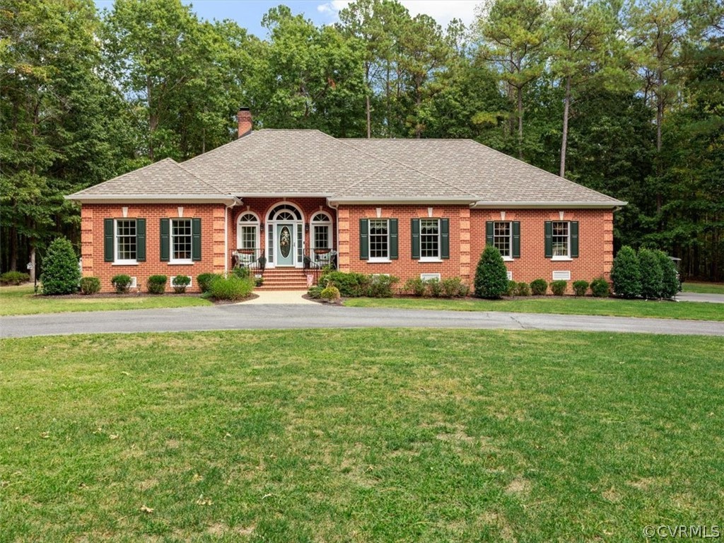 13030 River Road Chesterfield, VA 23838 - Photo 3 of 50 a front view of a house with a yard and trees