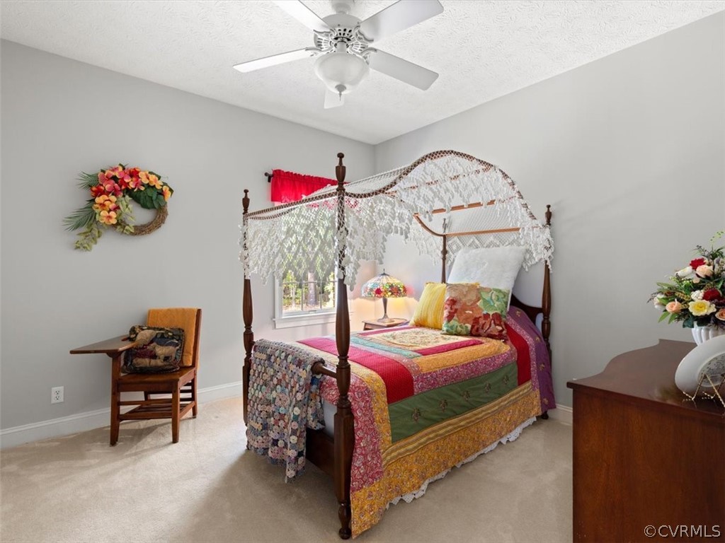 13030 River Road Chesterfield, VA 23838 - Photo 32 of 50 a bedroom with bed and a chandelier