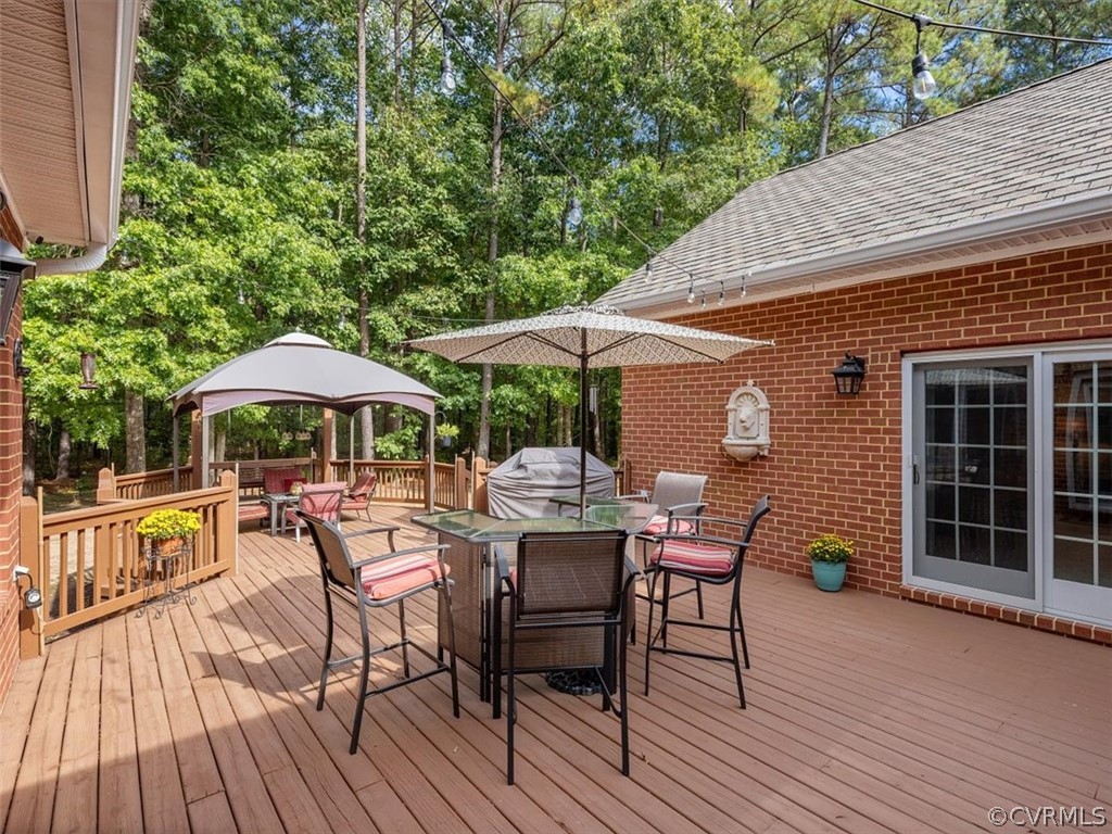 13030 River Road Chesterfield, VA 23838 - Photo 35 of 50 a patio with tables and chairs