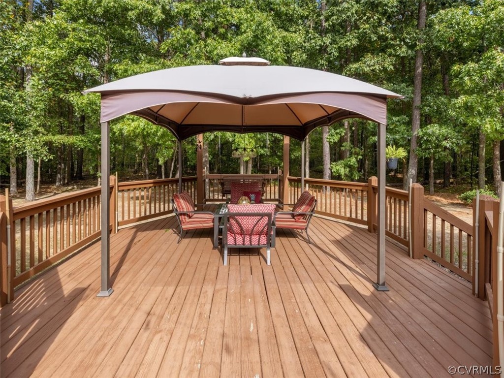13030 River Road Chesterfield, VA 23838 - Photo 36 of 50 a view of a wooden deck with furniture