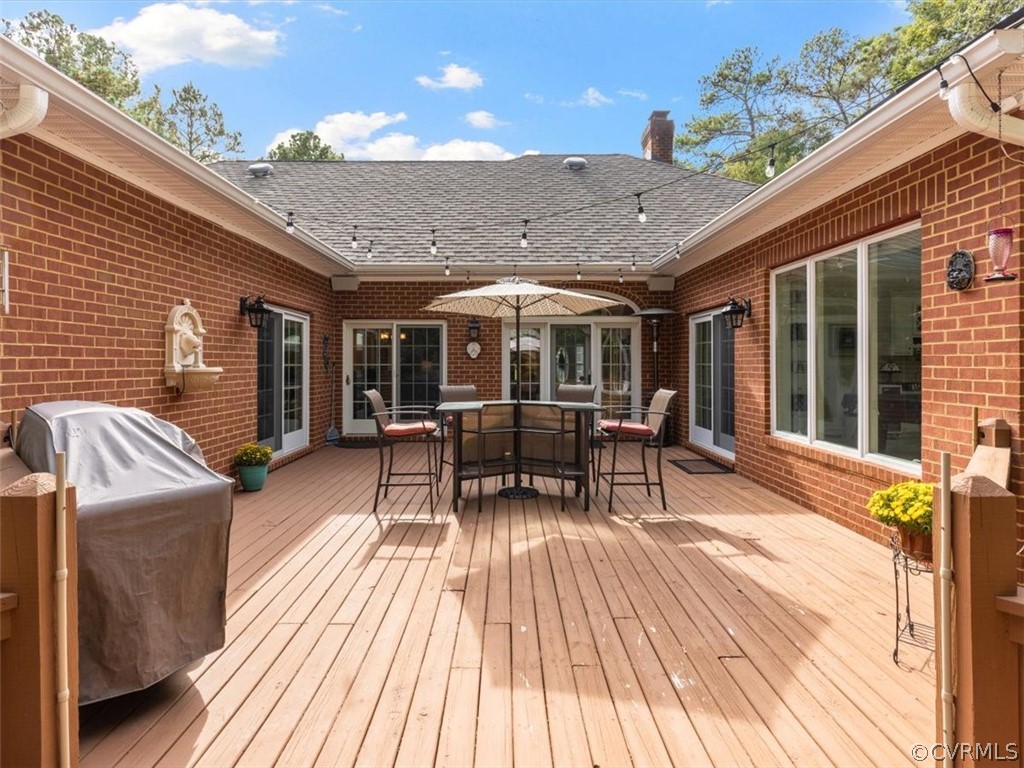 13030 River Road Chesterfield, VA 23838 - Photo 37 of 50 a view of a patio with table and chairs and wooden floor