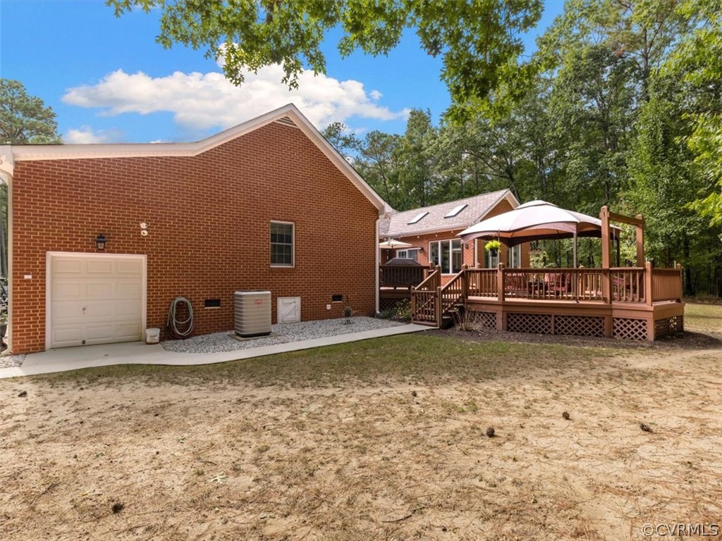 13030 River Road Chesterfield, VA 23838 - Photo 38 of 50 a backyard of a house with yard fire pit and outdoor seating