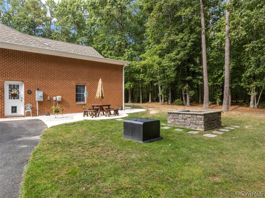 13030 River Road Chesterfield, VA 23838 - Photo 39 of 50 a view of a house with backyard and sitting area