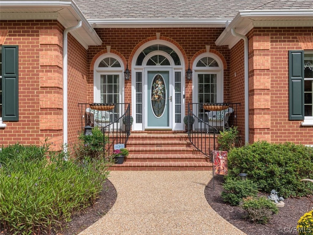 13030 River Road Chesterfield, VA 23838 - Photo 5 of 50 a front view of a house with a garden