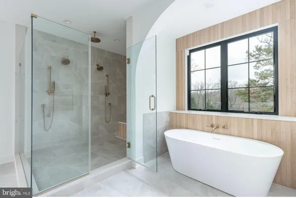 a white bath tub sitting next to a window