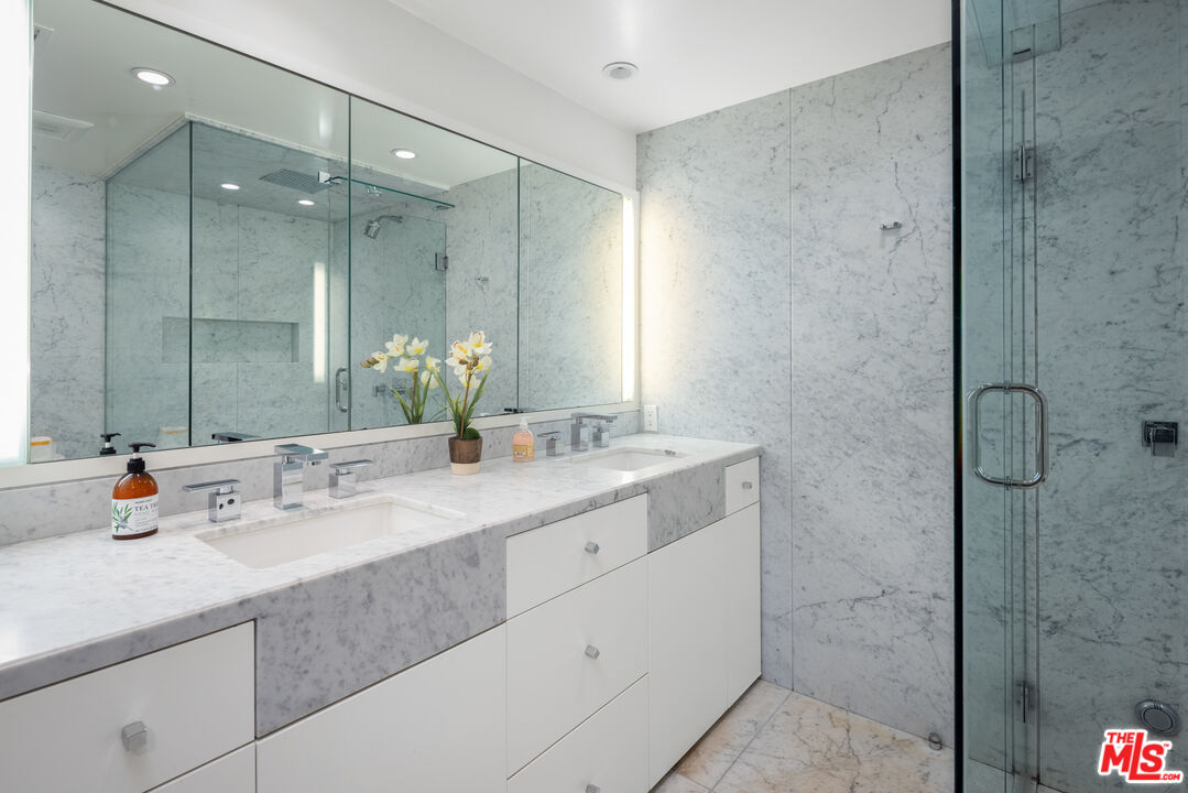 1000 Stradella Road Los Angeles, CA 90077 - Photo 12 of 45 a bathroom with a double vanity sink mirror and shower