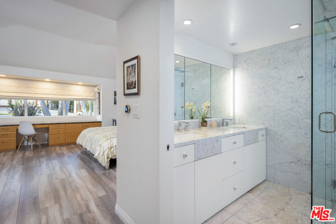 1000 Stradella Road Los Angeles, CA 90077 - Photo 15 of 45 a spacious bedroom with a bed and a couch