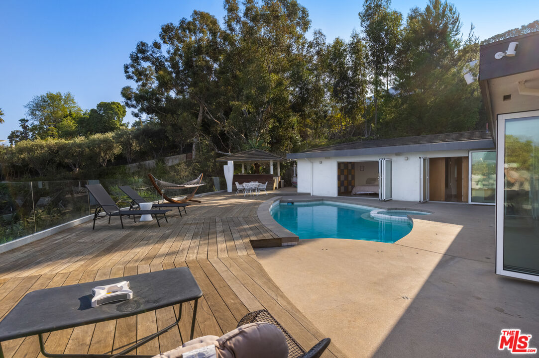 1000 Stradella Road Los Angeles, CA 90077 - Photo 28 of 45 a view of house with swimming pool outdoor seating