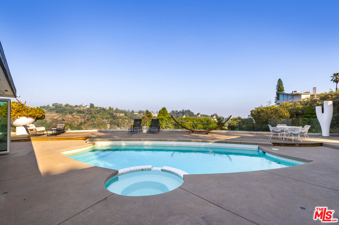 1000 Stradella Road Los Angeles, CA 90077 - Photo 32 of 45 a view of a swimming pool and an ocean view