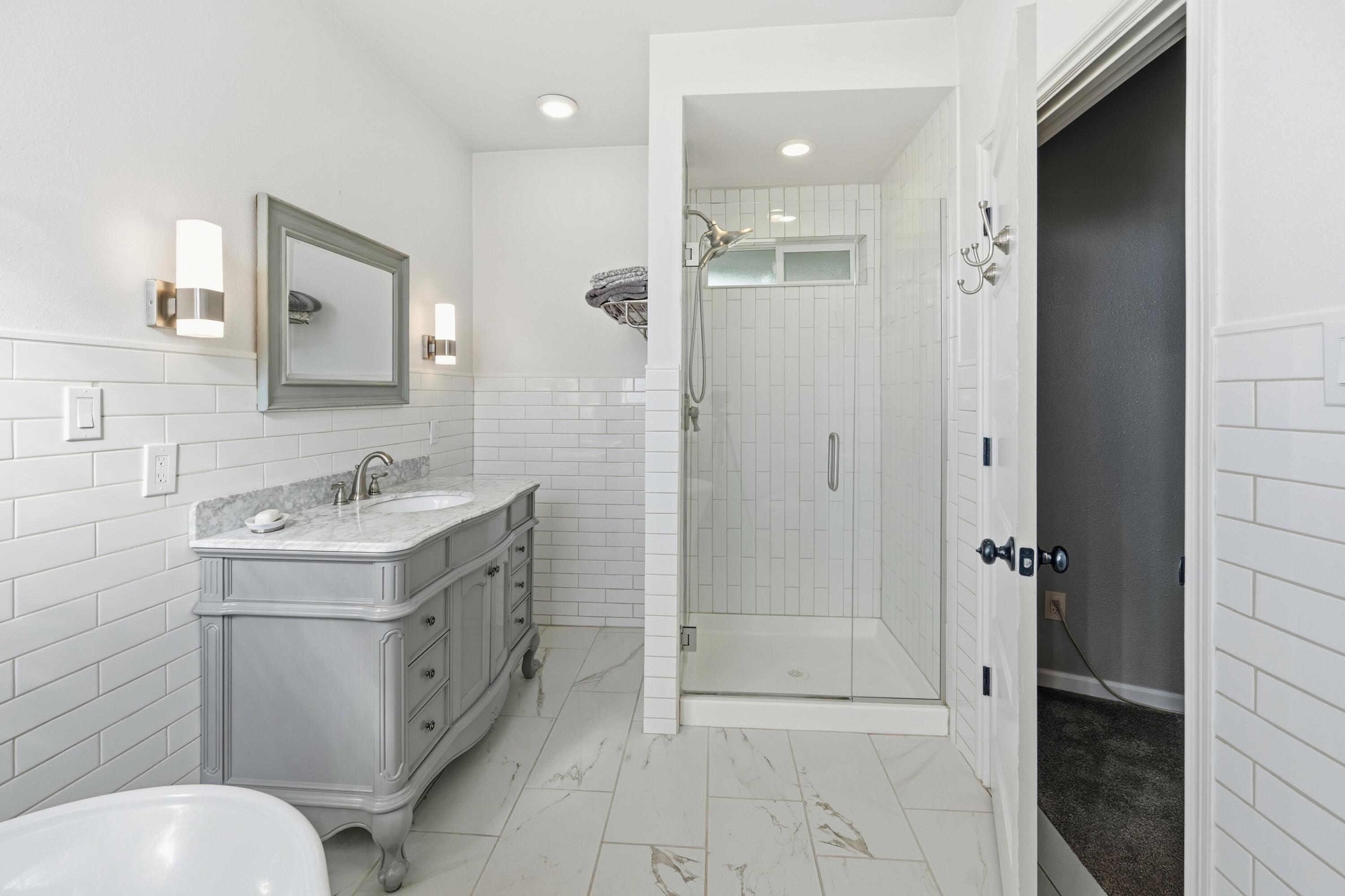 4074 Southwest Reif Road Powell Butte, OR 97753 - Photo 18 of 59 a bathroom with a sink toilet and shower