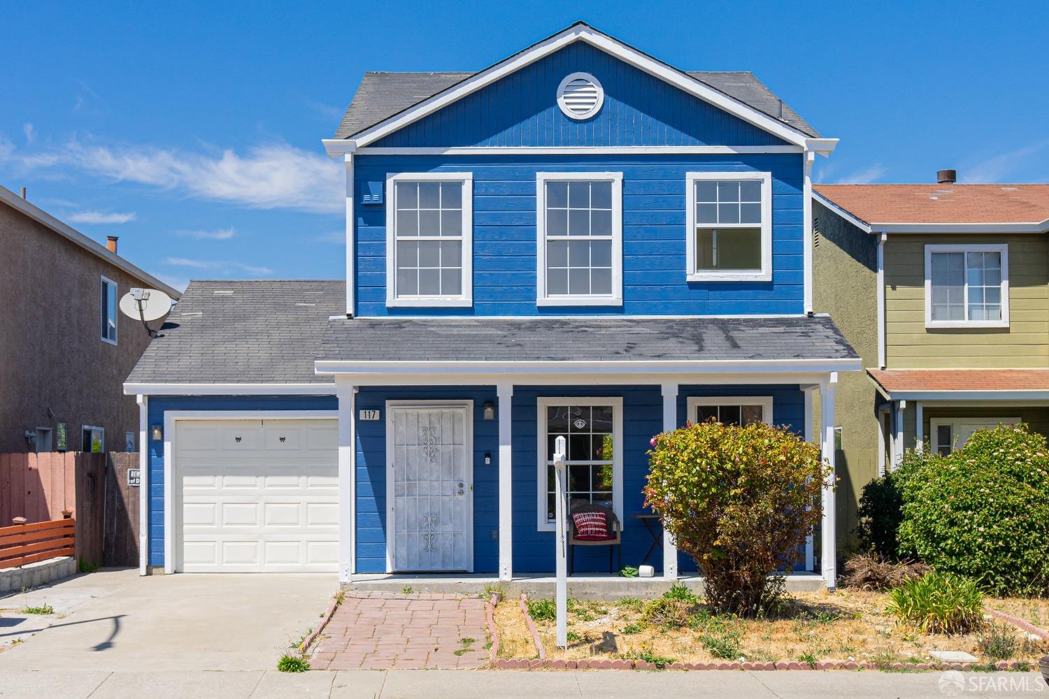 a front view of a house with garden