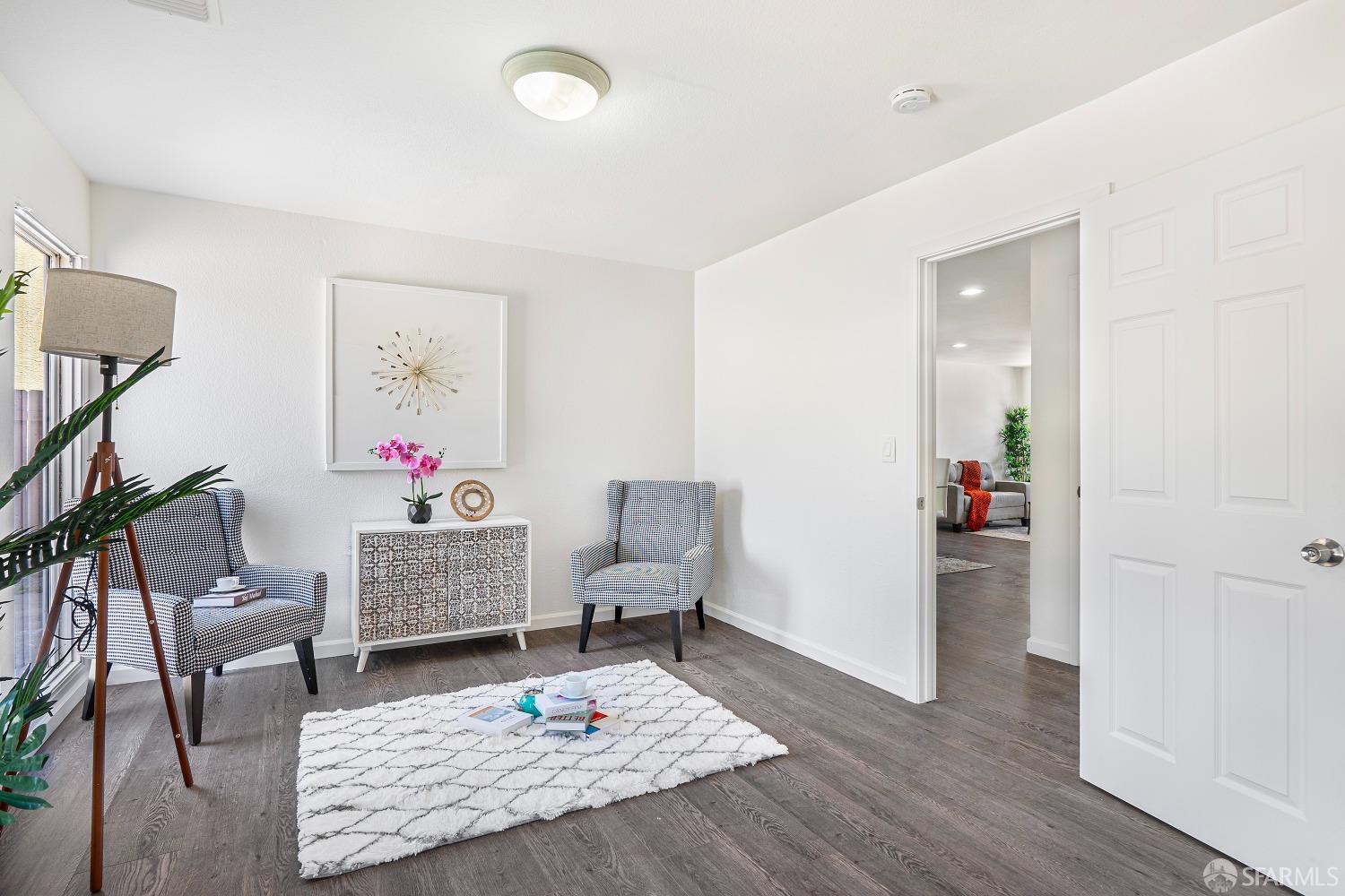 117 Malcolm Drive Richmond, CA 94801 - Photo 19 of 37 a living room with furniture and wooden floor