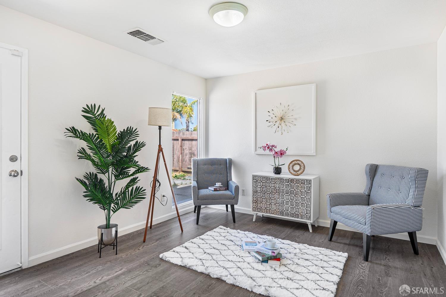 117 Malcolm Drive Richmond, CA 94801 - Photo 20 of 37 a living room with furniture and a potted plant