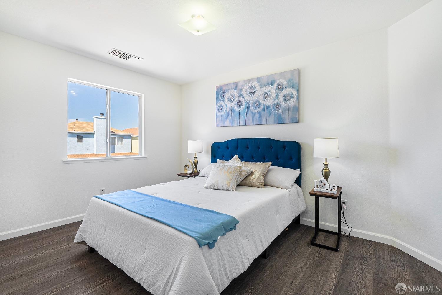 117 Malcolm Drive Richmond, CA 94801 - Photo 26 of 37 a bedroom with a large bed and a window