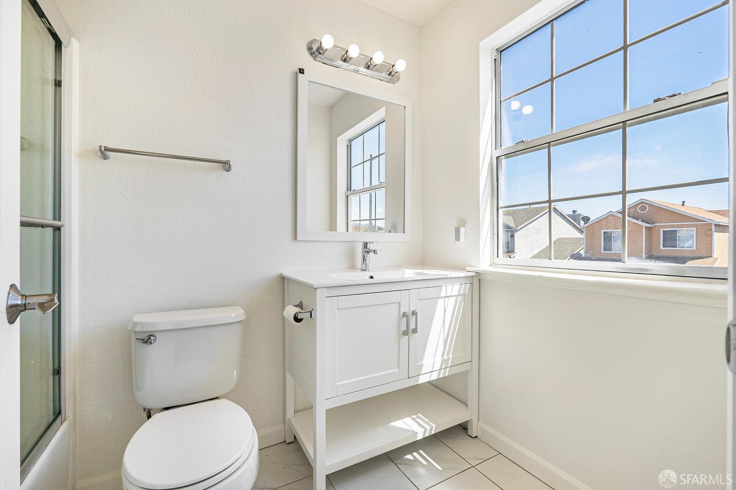 117 Malcolm Drive Richmond, CA 94801 - Photo 27 of 37 a bathroom with a toilet a sink and mirror