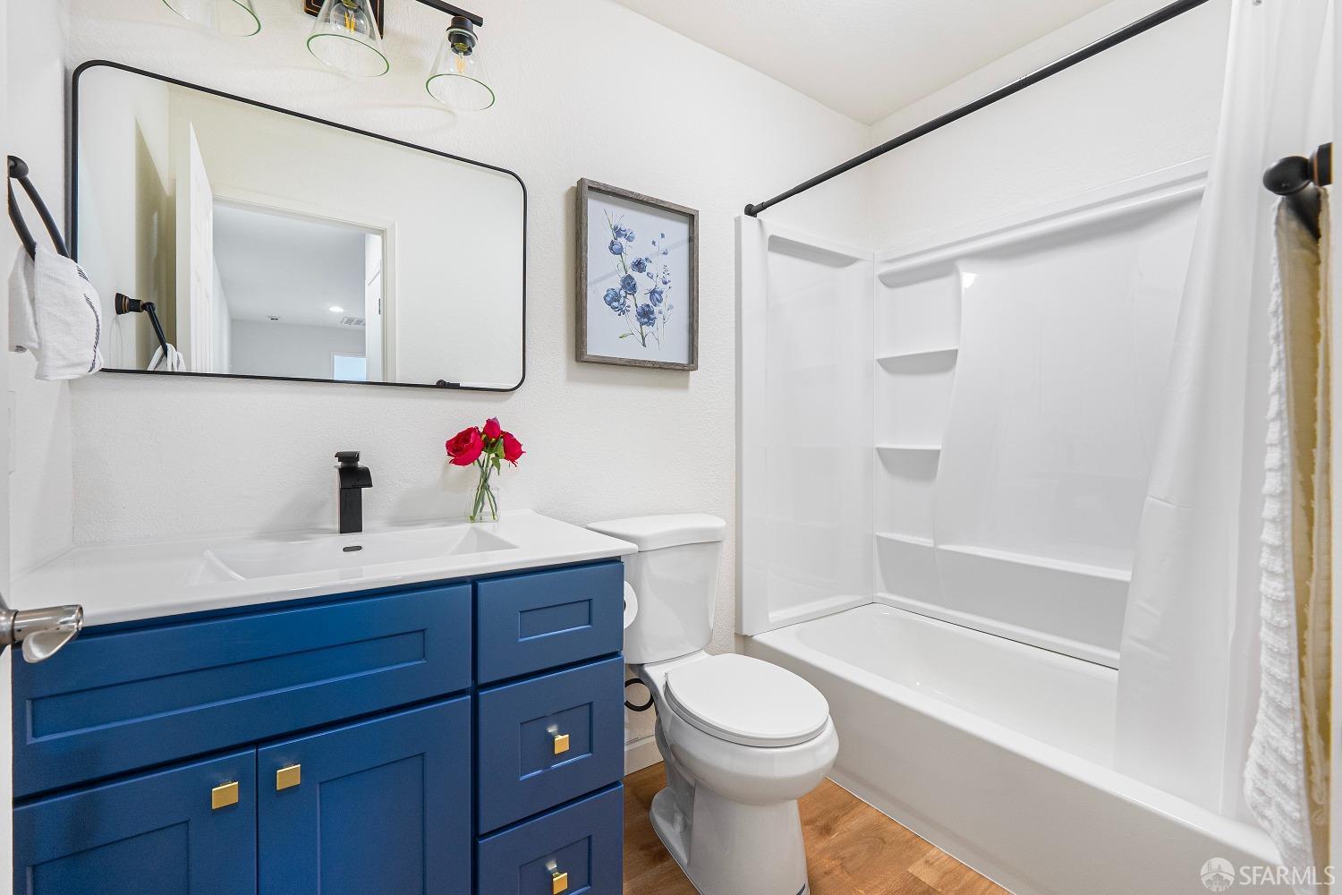 117 Malcolm Drive Richmond, CA 94801 - Photo 28 of 37 a bathroom with a sink vanity mirror and toilet