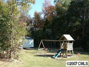 351 Knightsbridge Road Fort Mill, SC 29708 - Photo 2 of 2 a view of wooden deck and a yard with swimming pool