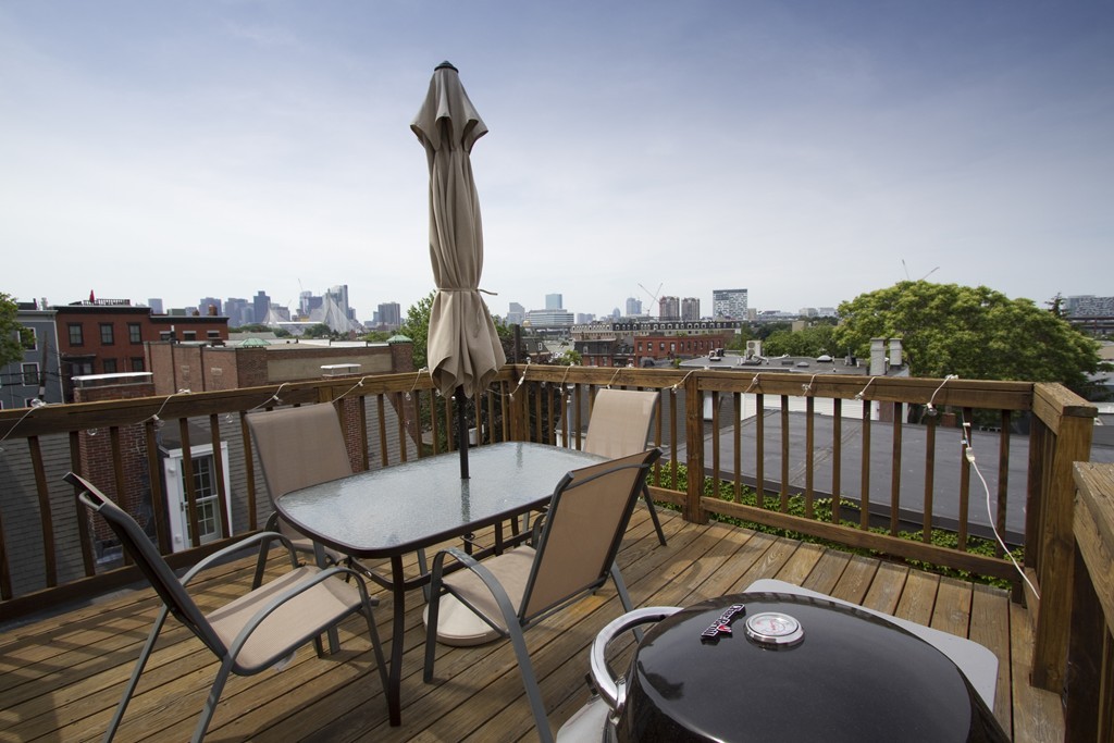 25 Sullivan Street, Unit 3 Boston, MA 02129 - Photo 12 of 13 a view of a balcony with furniture