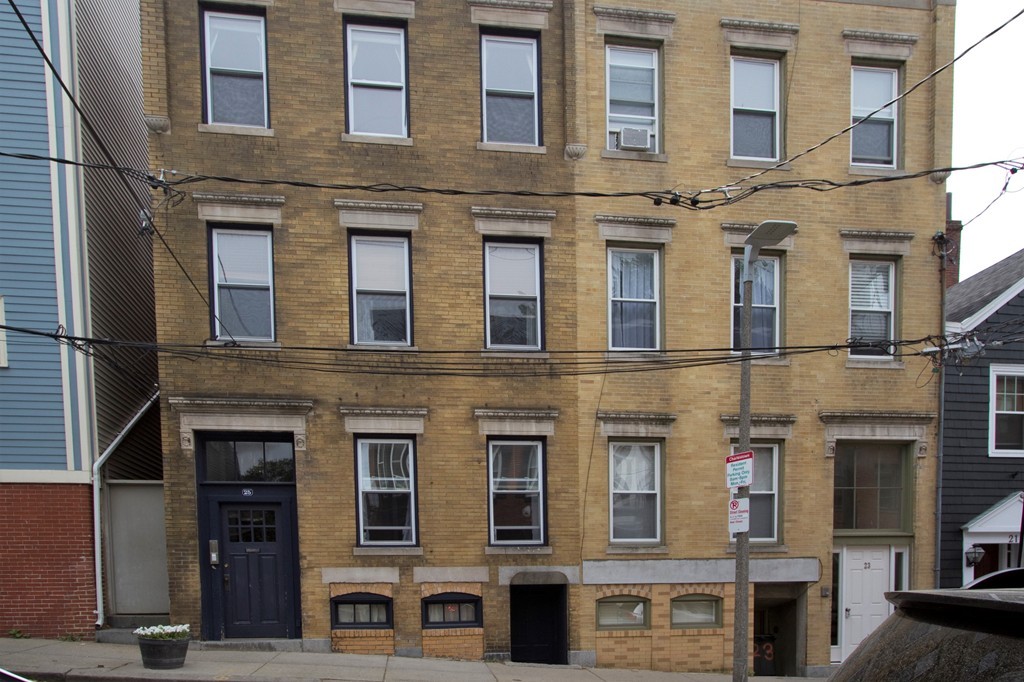25 Sullivan Street, Unit 3 Boston, MA 02129 - Photo 13 of 13 a front view of a building with a lot of windows