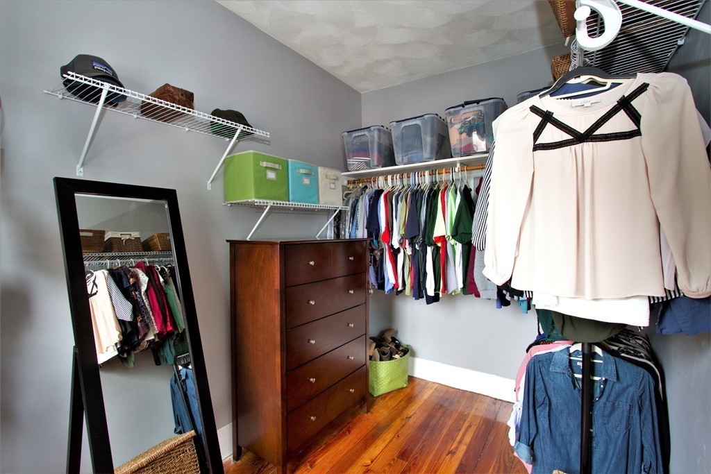 25 Sullivan Street, Unit 3 Boston, MA 02129 - Photo 5 of 13 a view of walk in closet with clothes and shoes