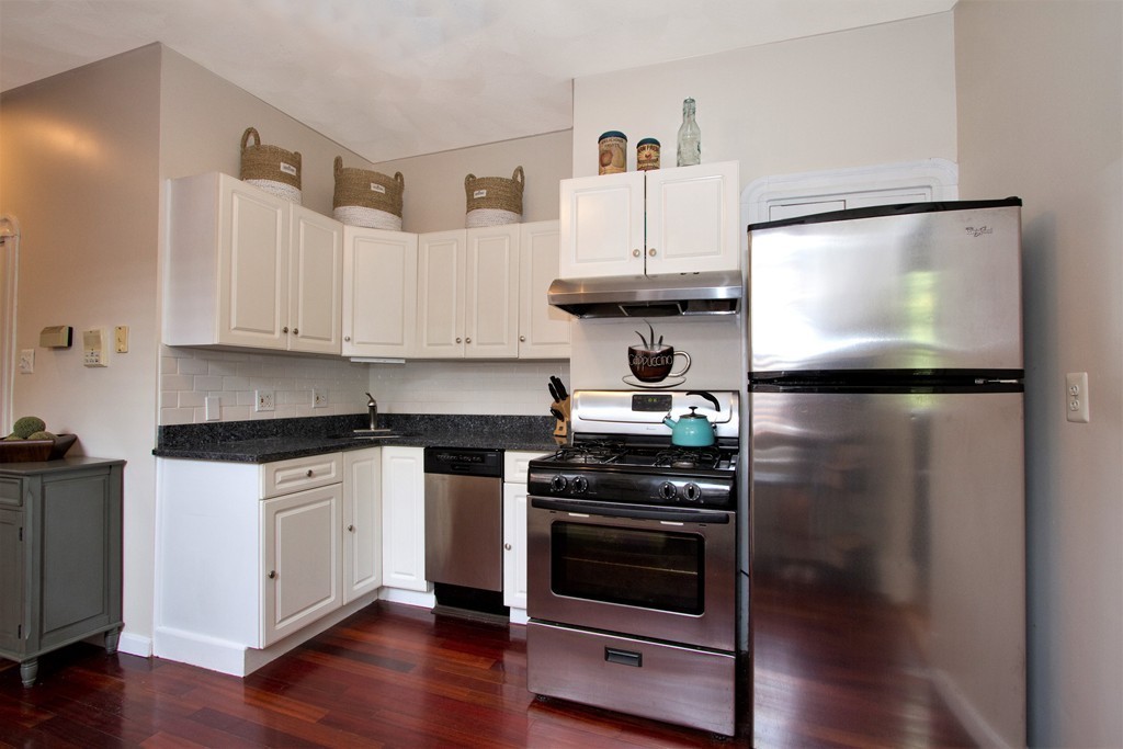 25 Sullivan Street, Unit 3 Boston, MA 02129 - Photo 7 of 13 a kitchen with cabinets and appliances