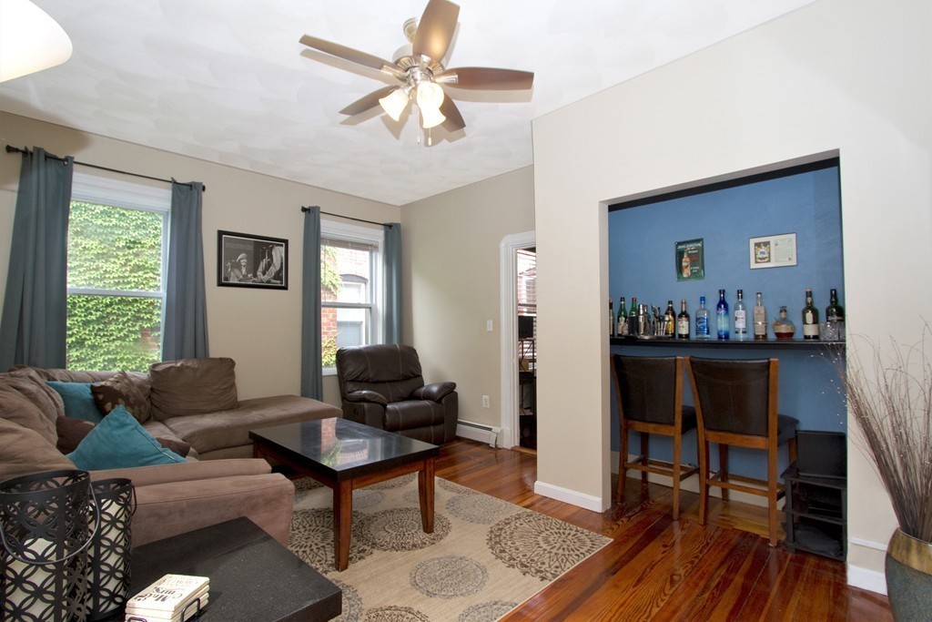 25 Sullivan Street, Unit 3 Boston, MA 02129 - Photo 9 of 13 a living room with furniture and a window
