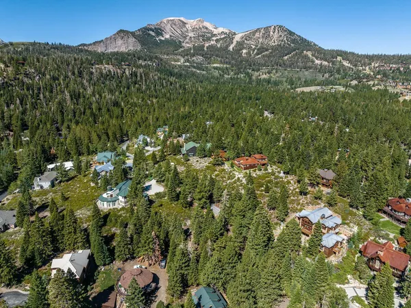 a view of a house with a mountain in the background