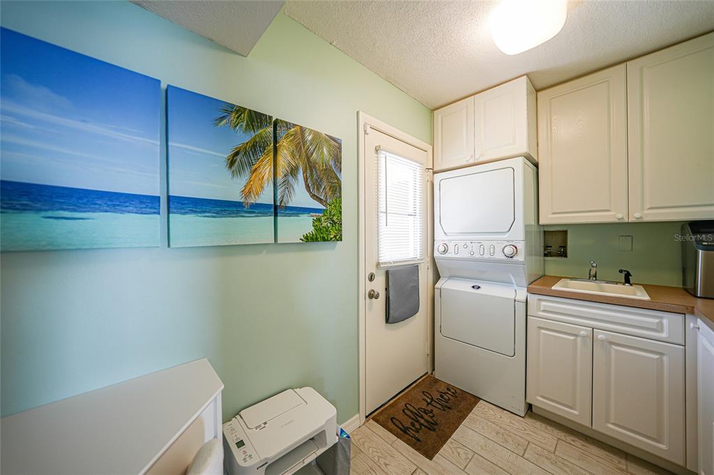 1 Colony Point Drive, Unit A10 Punta Gorda, FL 33950 - Photo 26 of 31 a room with a washer and dryer