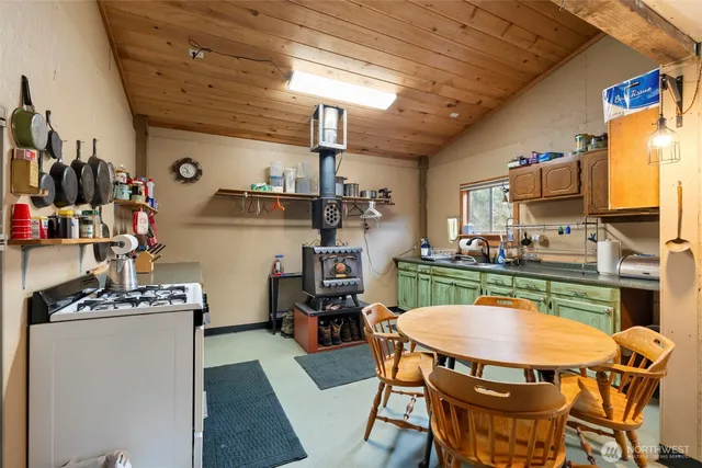 a dining room with furniture and a flat screen tv