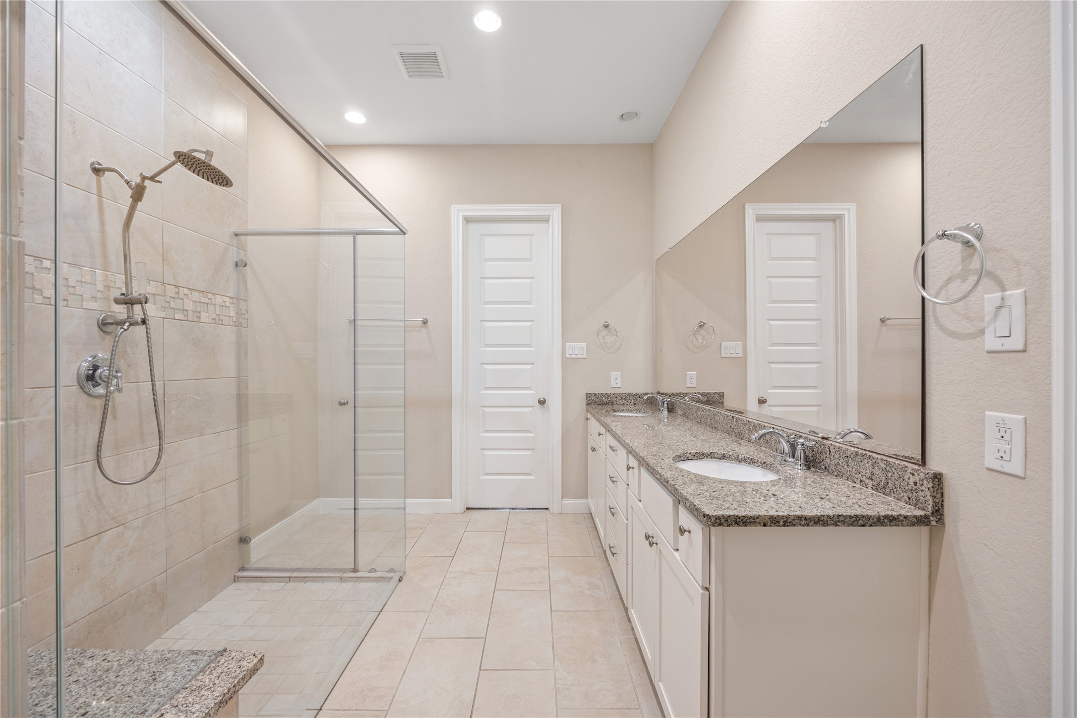 10408 Quiet Courtyard Road Houston, TX 77043 - Photo 12 of 24 Spacious primary bathroom with double vanities, a large walk-in shower, and walk-in closet.