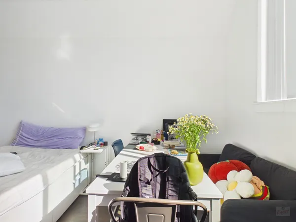 a kitchen with a stove and a refrigerator