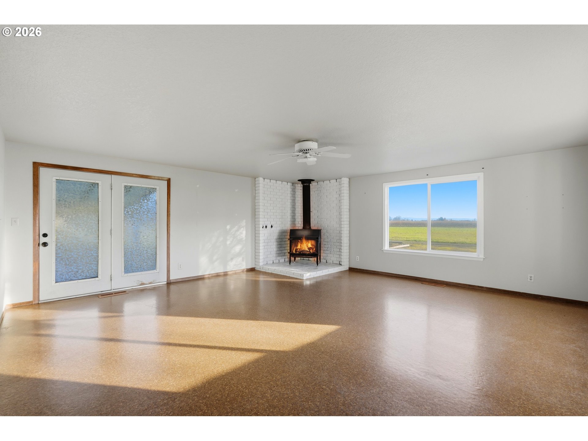 8949 South Gribble Road Canby, OR 97013 - Photo 13 of 36 a view of a room with wooden floor and a window