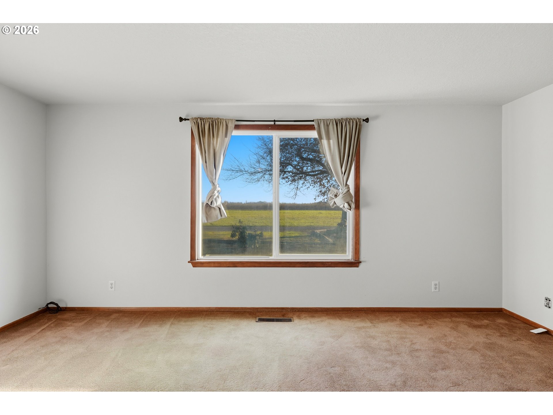 8949 South Gribble Road Canby, OR 97013 - Photo 18 of 36 a view of an empty room with a window