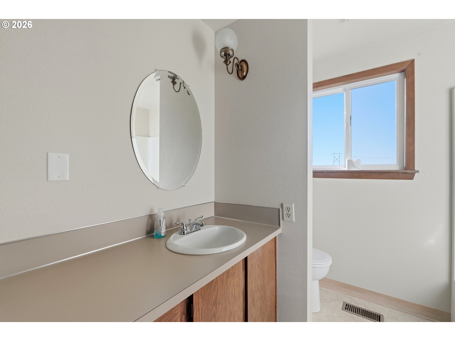 8949 South Gribble Road Canby, OR 97013 - Photo 19 of 36 a bathroom with a sink and a mirror