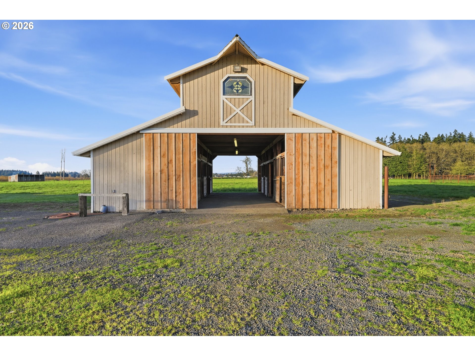 8949 South Gribble Road Canby, OR 97013 - Photo 28 of 36 a front view of a house with a yard and garage